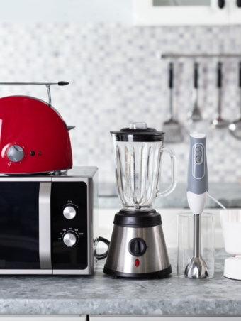 Close-up Of Home Appliance Arranged On Kitchen Worktop