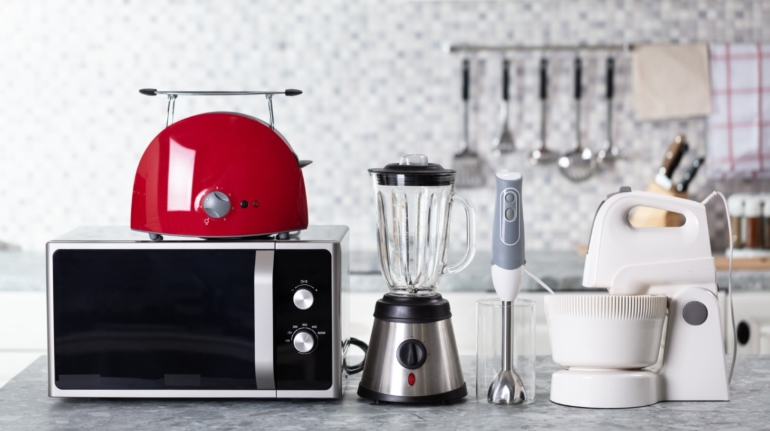 Close-up Of Home Appliance Arranged On Kitchen Worktop
