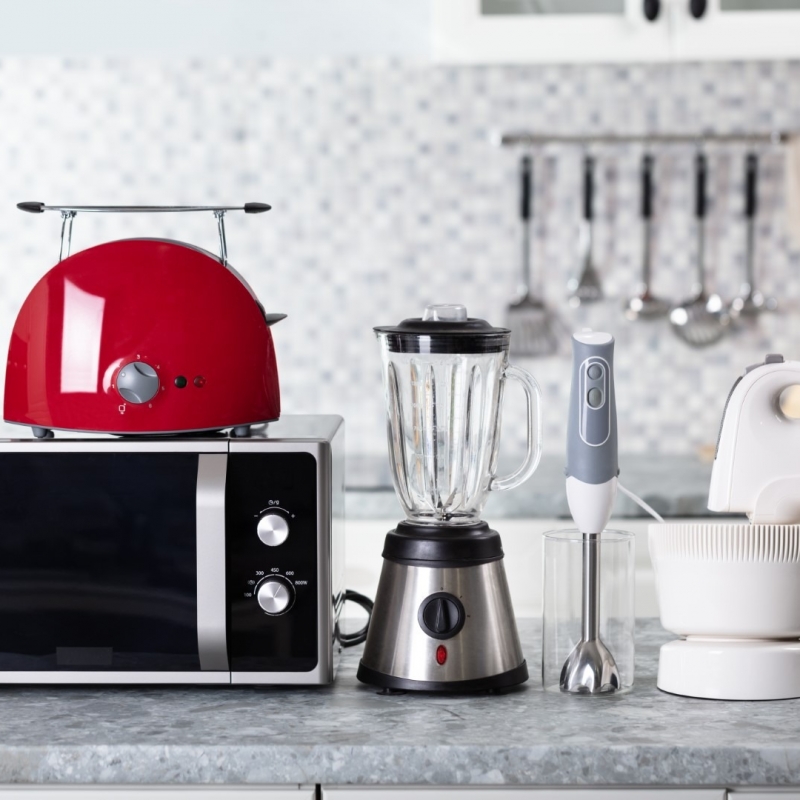 Close-up Of Home Appliance Arranged On Kitchen Worktop